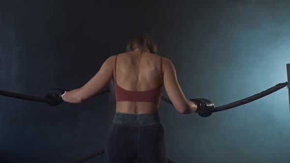 Athletic Woman Warms Up in the Ring Before the Fight