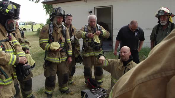 Firemen in a huddle as they prepare for training