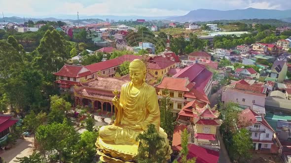 Camera Flies and Shows Amazing Golden Buddha in Meditation