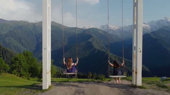 Mother and Daughter at the swing