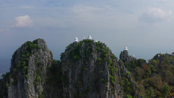 Aerial View of Wat Chaloem Phra Kiat Phrachomklao Rachanusorn Sky Pagodas on Top of Mountain in alt