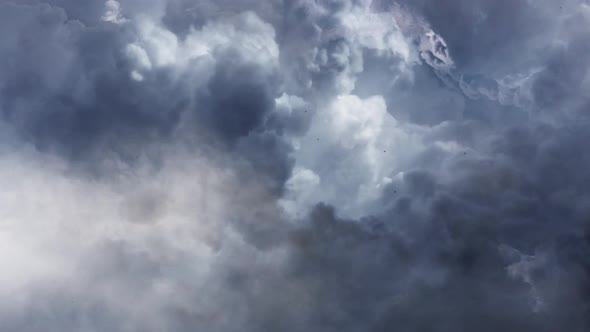 4k  thunderstorm within a thick  cumulus cloud in the sky