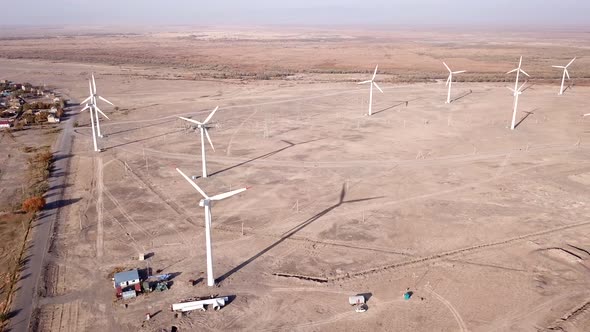 Windmills in the steppe. Near a small town