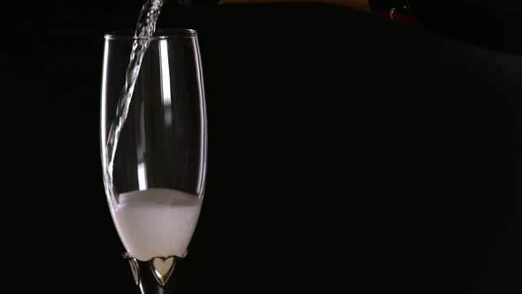 Pouring a Glass of Effervescent Bubbly Champagne