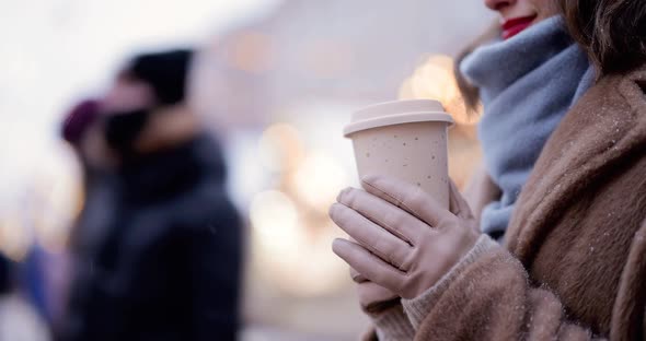 Holding a Coffee Cup at Christmas Market