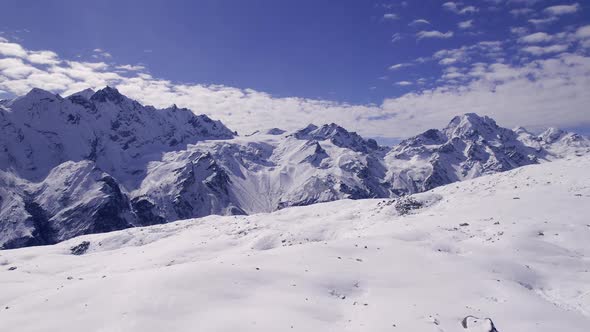 Flying over snow in the Himalayas looking at the mountains