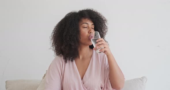 A Young Black Lady Hold a Glass of Clean Pure Mineral Water Improve Health and Wellbeing