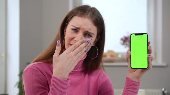 Astonished Young Beautiful Woman Looking at Camera with Excited Facial Expression Looking at Green