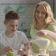 Mother and Son Heaving Breakfast at Home - VideoHive Item for Sale