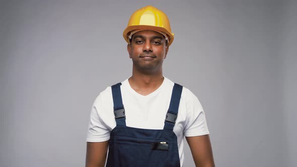 Happy Smiling Indian Worker or Builder in Helmet