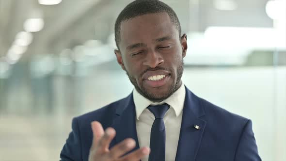 Portrait of African Businessman Talking on Video Call