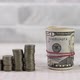 stack of dollar banknotes rolled up with rubber near money coin towers - VideoHive Item for Sale