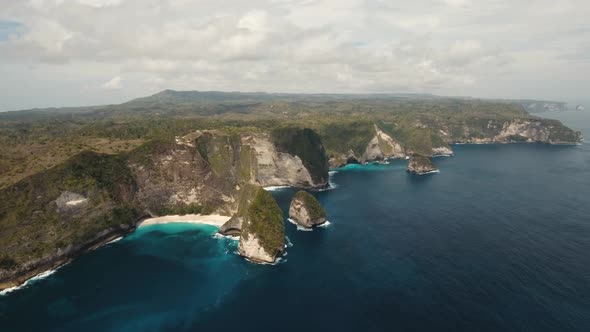 Rocky Cliff with Beach in the Sea