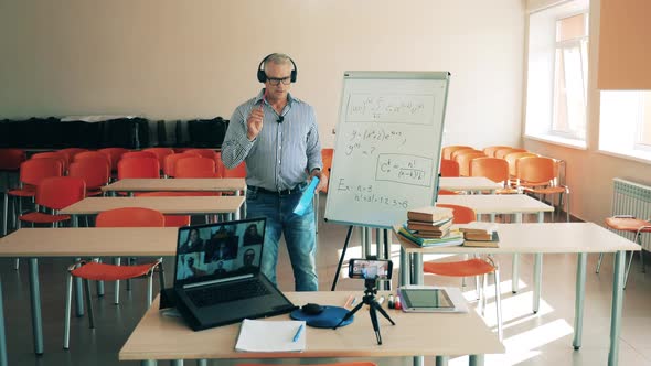 A Man Is Conducting an Online Class for Multiple Users. On-line Class, Remote Studying Concept.