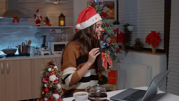 Cheerful Woman Exchanging Gifts on Laptop Video Call