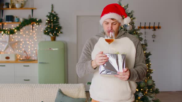 Man with Gift and Glass of Alcohol