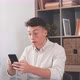 Overjoyed caucasian ethnicity teenager sit at desk looks at phone screen read incredible news - VideoHive Item for Sale