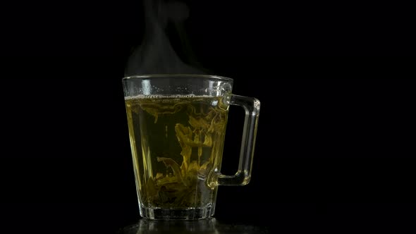 Tea leaves in a transparent cup.