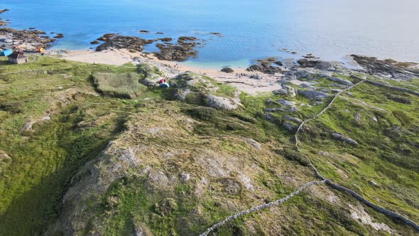 Camping Tents On The Rocky Bay Of The Beautiful Coral Strand Beach In Connemara, Ireland - aerial