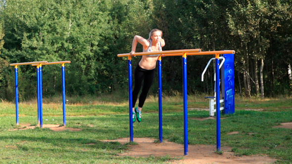 Girl Training on Parallel Bars