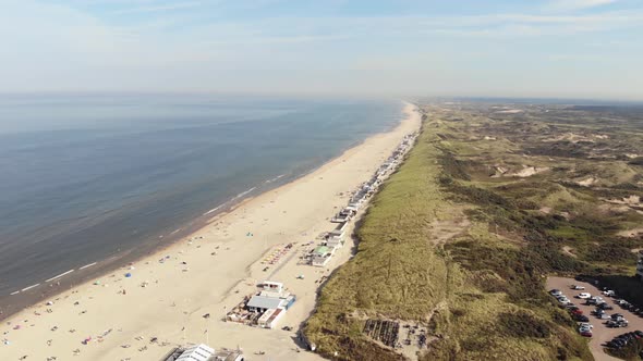 Long and wide Wijk aan Zee beach, soft sand, smooth water and dunes, Holland