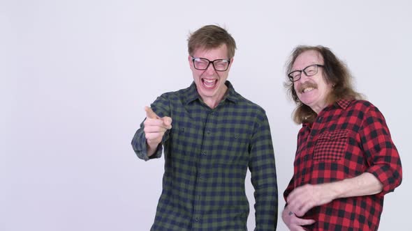 Happy Senior Hipster Man and Young Hipster Man Laughing Together