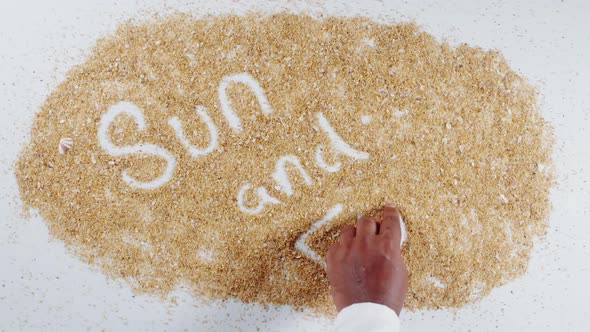 Hand Writes On Beach Sand Sun And Fun