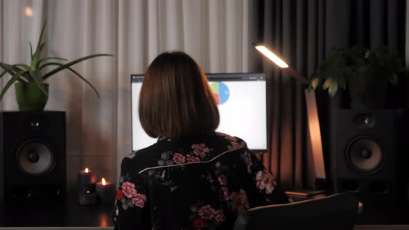 Female leaving office desk at home. Working from home