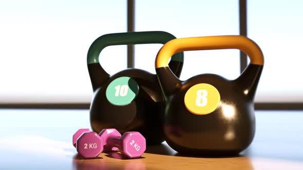 Heavy steel Kettlebells And Dumbbells on the modern gym floor. Fitness, aerobics