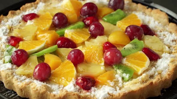 Cake with Fresh Fruit and Berries with Cream Rotates on Tray