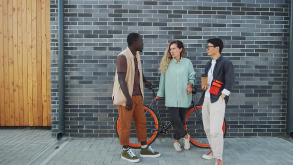 Multiethnic Friends Chatting on City Street