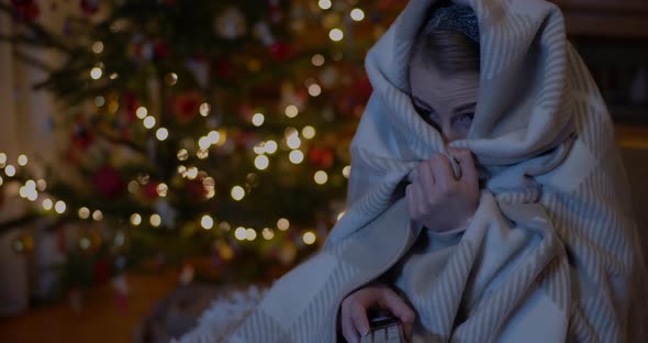 Woman Watching Horror Movie on TV at Home