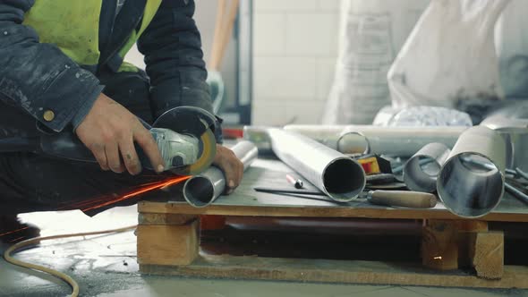 Male Locksmith Working in Production