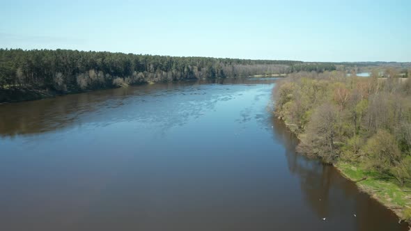 AERIAL: Reveal Shot and Flying Above River Nemunas on Sunny Day