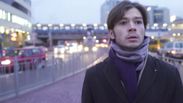 Man Walks Down The Street In Despair