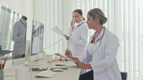 Female Doctors Working Together in Medical Office