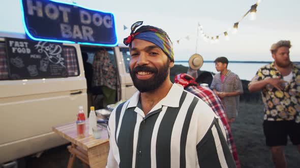 Portrait of Joyous Middle Eastern Man on Summer Festival