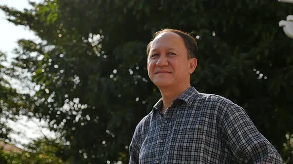 Close Up Of Happy Asian Old Man With Nature Background