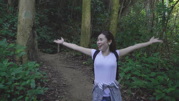 Tourist Woman Walking And Enjoying At Forest Trail