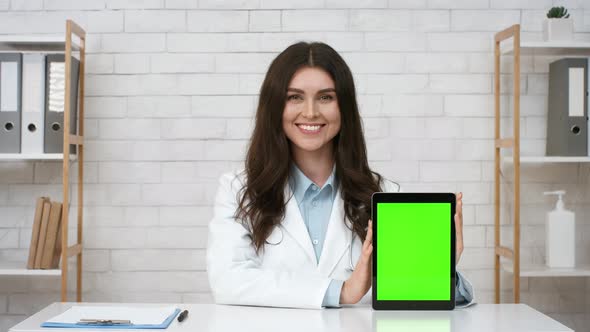 Doctor Lady Showing Digital Tablet With Chroma Key Screen Indoors