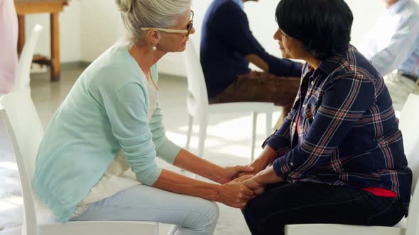 Senior therapist consoling a patient 4k