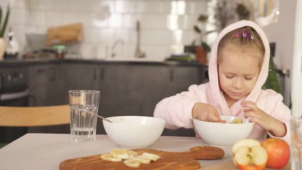 Cute Little Girl After Shower Dressed Bathrobe Having Breakfast Kitchen Sitting Table Child Eats