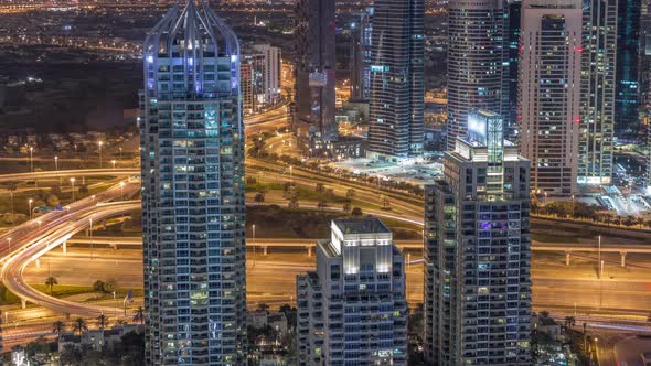 Dubai Marina Skyscrapers and Jumeirah Lake Towers View From the Top Aerial Night Timelapse in the