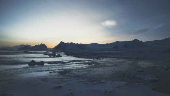 Polar Night Above Arctic Snow Mountain Aerial View