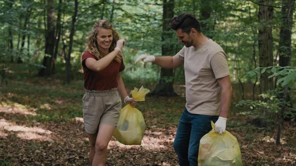 Caucasian adult couple cleaned forest from garbages. Shot with RED helium camera in 4K.