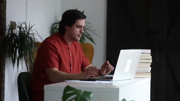 Man working at home office at laptop