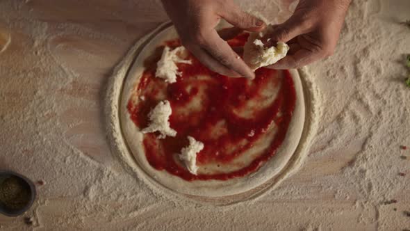 Chef Cooking Homemade Pizza in Kitchen