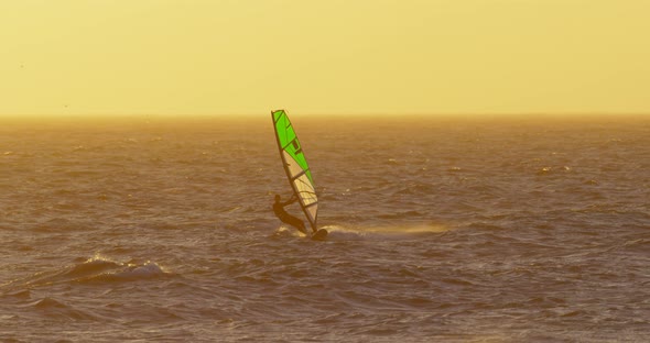Male Surfer Windsurfing in The Beach 4k