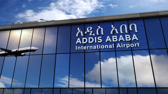 Airplane landing at Addis Ababa Ethiopia airport mirrored in terminal