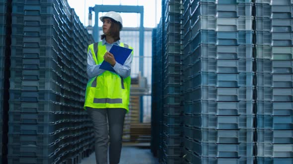 Focused Storekeeper Checking Boxes Analysing Pallets Before Shipping Delivery